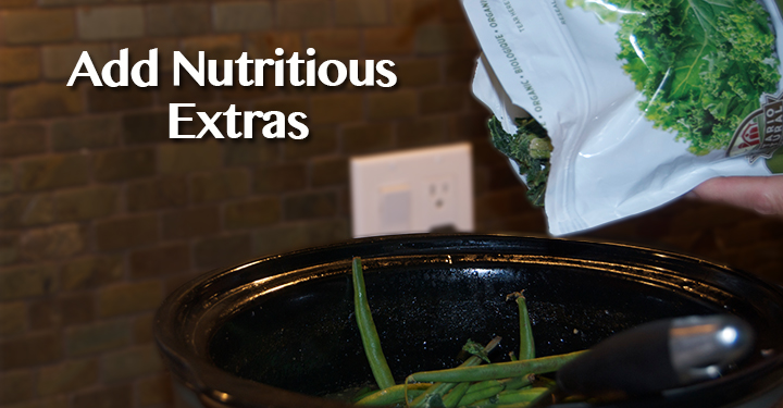 B\Green vegetables being added to the bone broth for dogs