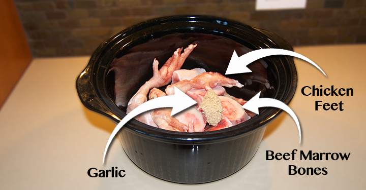 Bowl with bone broth ingredients for dogs